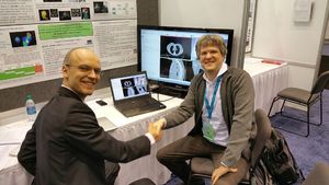 Andrey Fedorov (BWH) and David Flade (Brainlab) at QIRR booth.